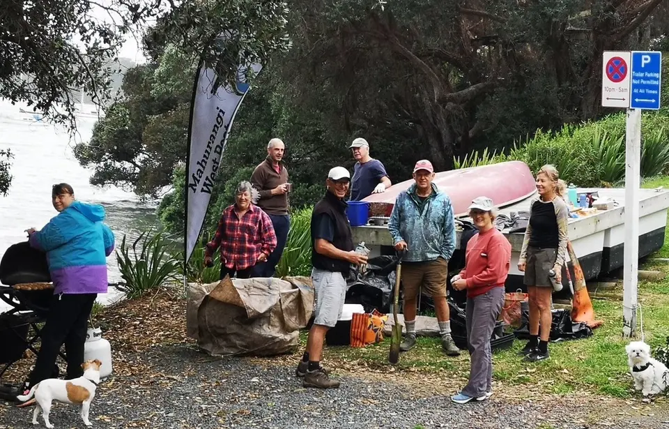 Volunteers taking a barbecue break at the Jamieson Bay planting bee
